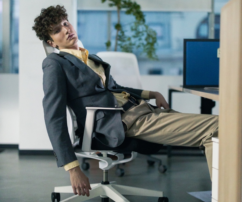 man slumped on chair looking tired (1).png